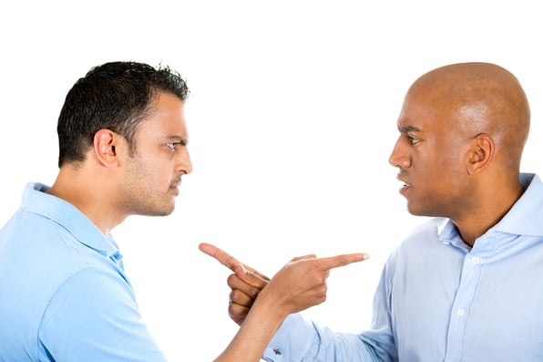 Closeup portrait of two angry guys pointing fingers at each other and blaming for problems, isolated on white background. Interpersonal conflict resolution. Human emotions and facial expressions.