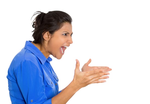 Closeup side view profile portrait of mad angry, upset hostile young woman, worker, furious employee, yelling hands in air, isolated white background. Negative emotions, facial expressions, reaction