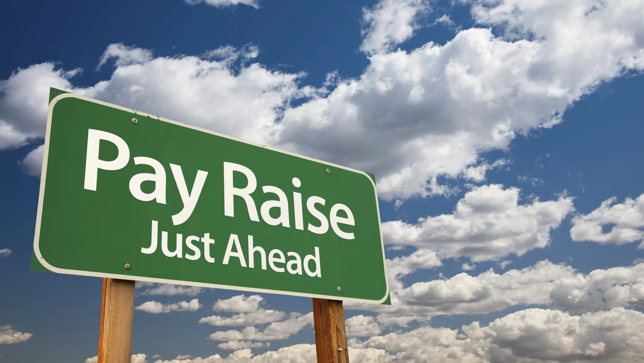road sign that says pay raise